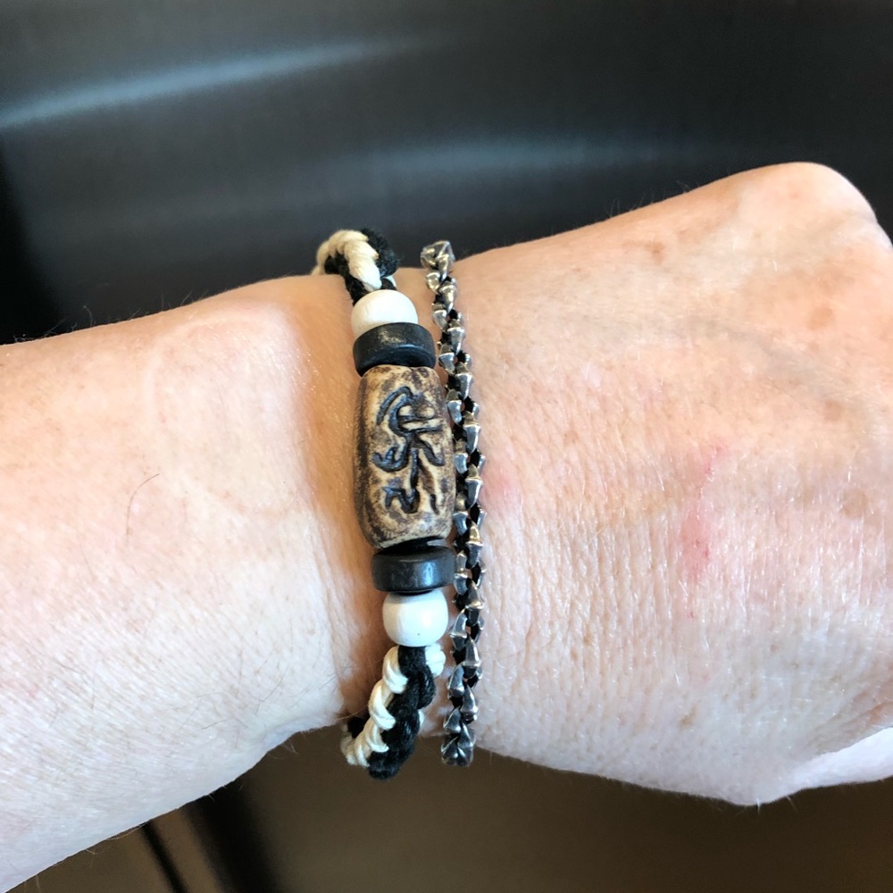 3/&35 Alaskan carved beads on weaved Black & cream  cording size 7” to 8”